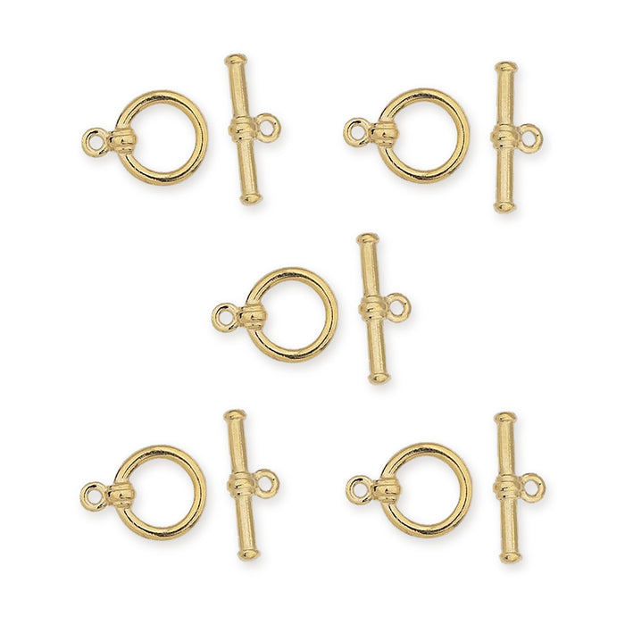 Gold plated bar and ring toggle clasp sets, five clasps with rings and bars laid out in a pattern