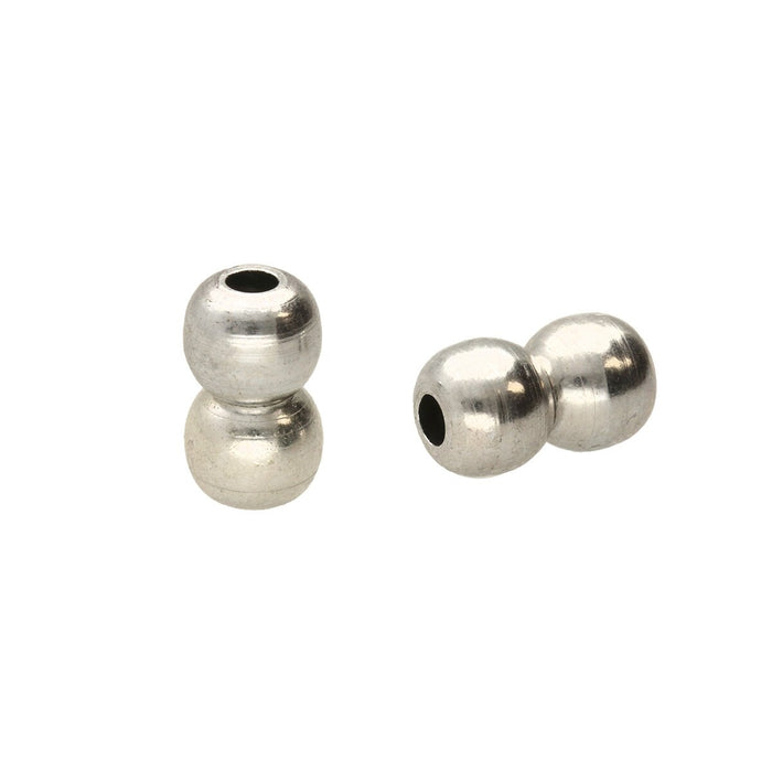 Two antiqued silver magnetic ball clasps, one joined and one standing, showing the hole in the end