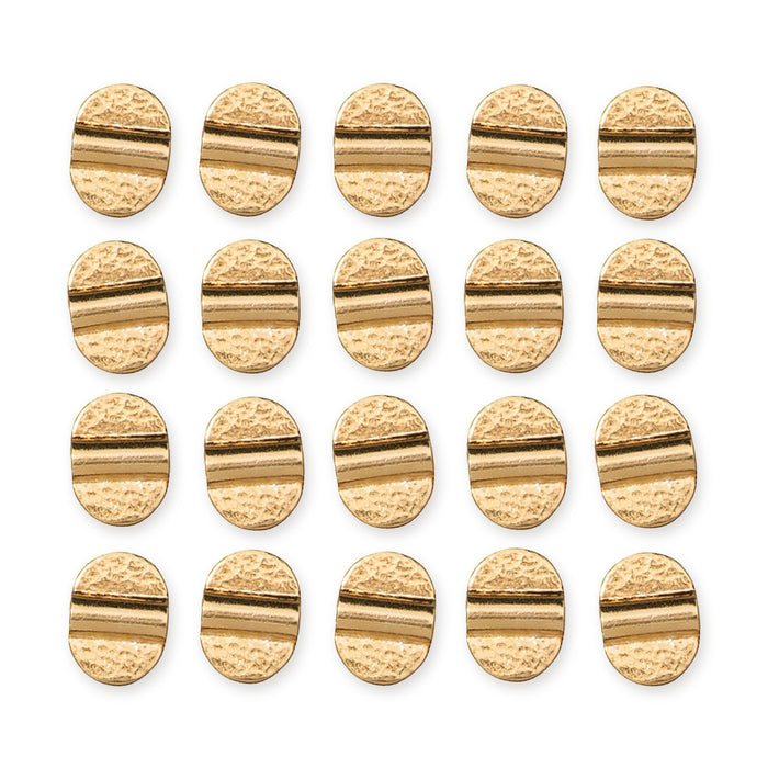 24K gold plated hammered Baule beads arranged in a grid of four rows of five, showing the oval shape and ridged center
