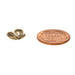 Side view of an antiqued brass flower bead cap next to a US penny for size comparison