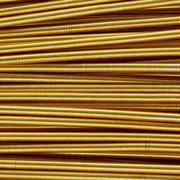 Close-up of gold French wire coils showing the tightly wound, ridged metallic surface texture