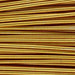 Close-up of gold French wire coils showing the tightly wound, ridged metallic surface texture