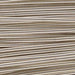 Close-up of silver French wire showing the tightly coiled, ridged surface texture