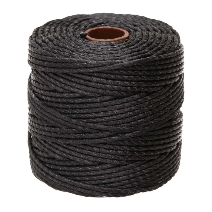 Full spool of black heavy nylon macrame cord seen from the front with its brown cardboard core