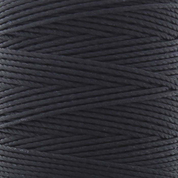 Close-up of the twisted black nylon S-Lon bead cord wound on the spool