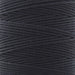 Close-up of the twisted black nylon S-Lon bead cord wound on the spool