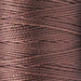 Close-up of the twisted 3-ply texture of brown S-Lon nylon bead cord wound on a spool