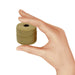 Illustrated hand holding a small spool of bronze S-Lon nylon bead cord to show its size