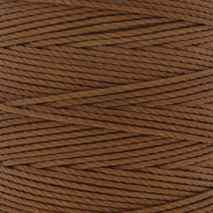 Close-up of the twisted 3-ply texture of milk chocolate brown S-Lon nylon cord wound on the spool