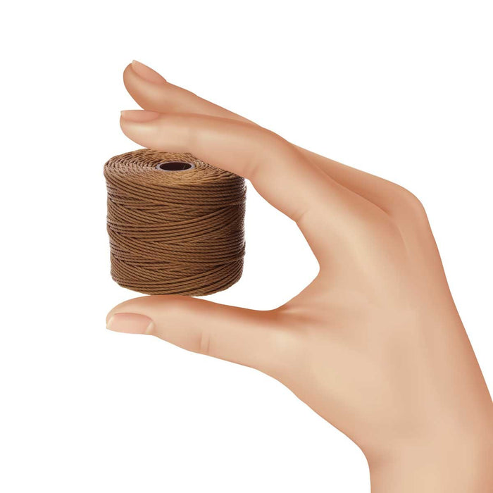 Hand holding a small spool of S-Lon milk chocolate nylon bead cord to show its size