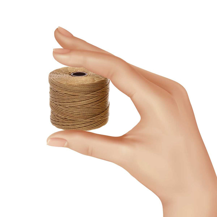 Hand holding a small spool of dark tan S-Lon nylon bead cord to show its size