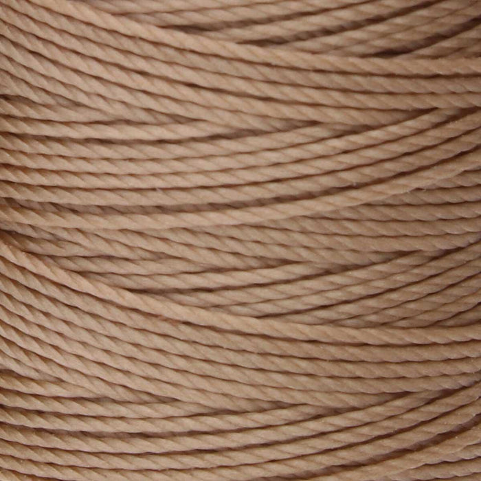 Close-up of the twisted texture of light brown S-Lon nylon bead cord wound tightly