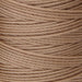 Close-up of the twisted texture of light brown S-Lon nylon bead cord wound tightly