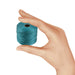 Hand holding a small spool of teal S-Lon nylon bead cord to show its size