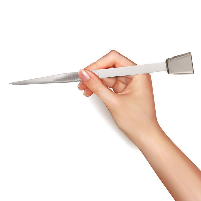 Hand holding the tweezers like a pen, showing the pointed tip and flat shovel end