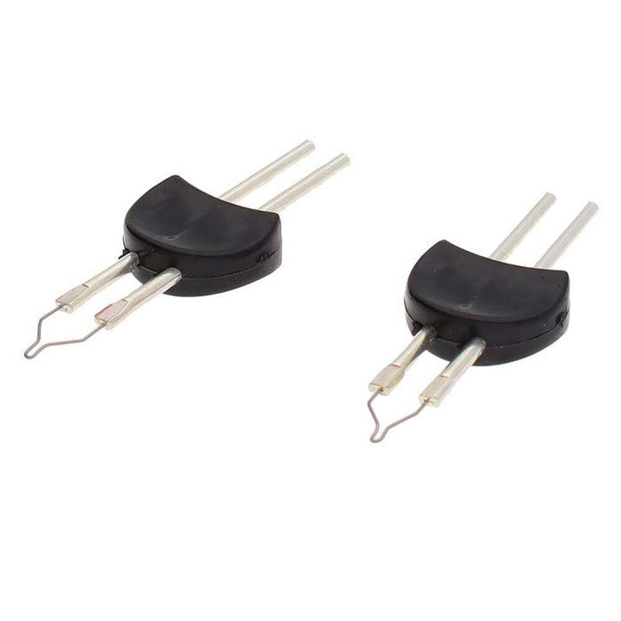 Pair of black-based metal replacement tips with wire loops, angled view on white background