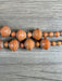 Hidden Gems: Assorted Orange Paper Beads