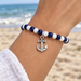 Antiqued silver anchor charm on a navy and white bead bracelet, design idea