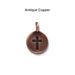 Antiqued copper cross coin charm, front
