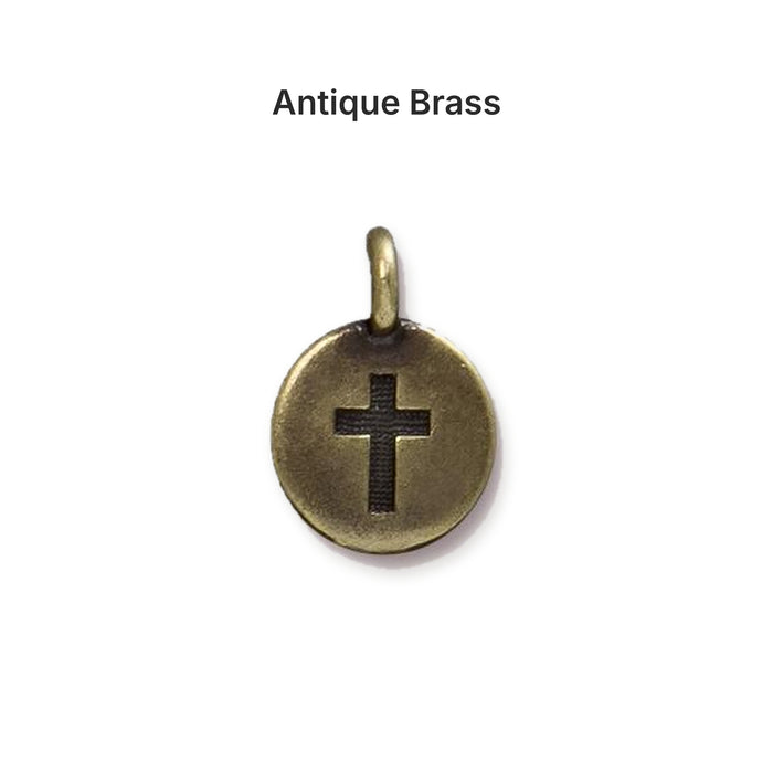 Antiqued brass cross coin charm, front