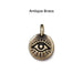 Antiqued brass evil eye coin charm, front