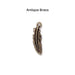 Antiqued brass feather charm, front