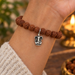 Antiqued silver Ganesh charm on a rudraksha mala bracelet, design idea