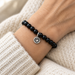 Antiqued silver heart charm on a black onyx bead bracelet, design idea