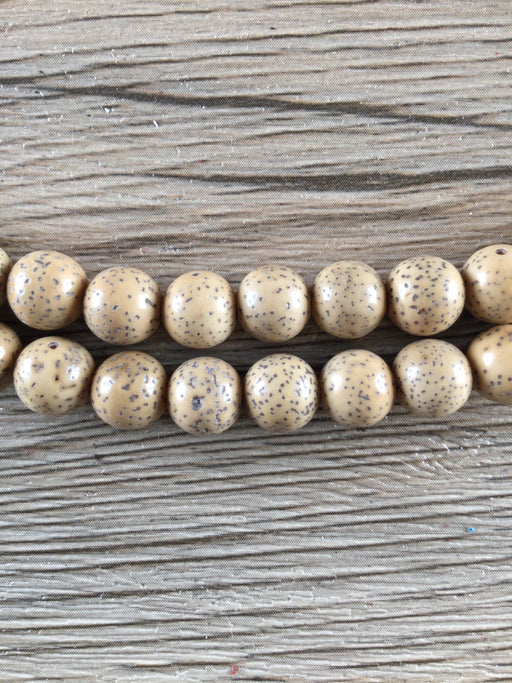 Hidden Gems: Round Beige Nepal Lotus Beads