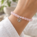 Antiqued silver open lotus charm on a rose quartz bead bracelet, design idea