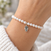 Tiny antiqued silver hamsa charm on a pearl bracelet, design idea