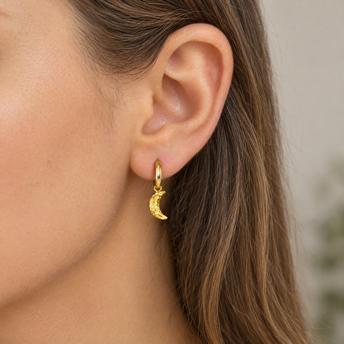 Gold plated crescent moon charm on a gold hoop earring, design idea