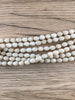 Hidden Gems: White 6 Strand Naga Bead Necklace (1 Strand Broken)