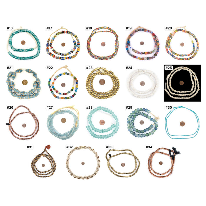 The real strands numbered 16-34, each photographed with a penny for scale: Studio Collection bead sets
