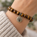 Antiqued brass tree of life charm on a tiger eye bead bracelet, design idea