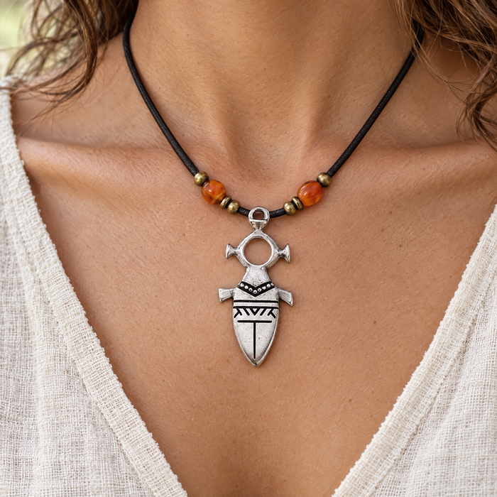 Antiqued silver Tuareg motif pendant on a leather cord necklace, design idea