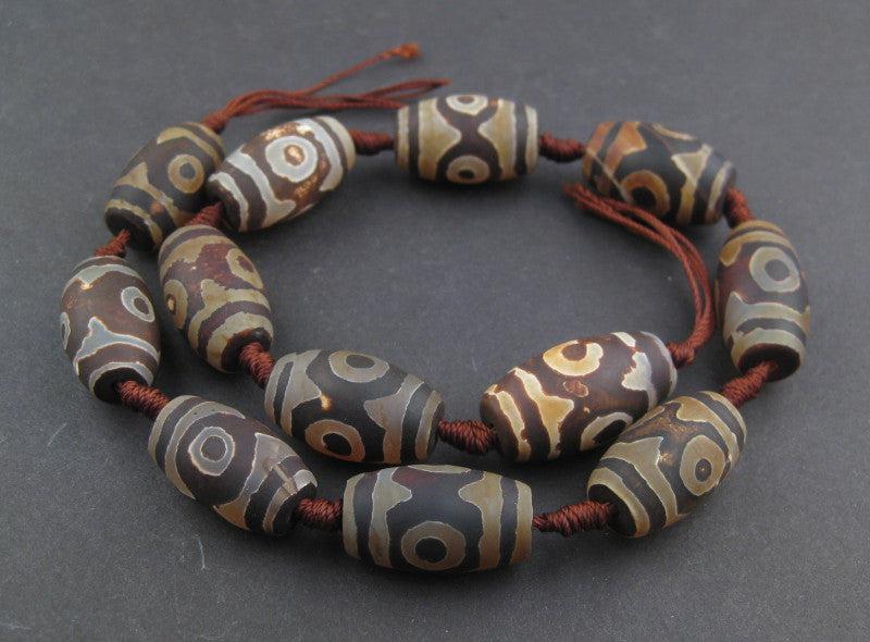 Dark Oval-Shaped Tibetan Agate Beads (23x15mm) - The Bead Chest